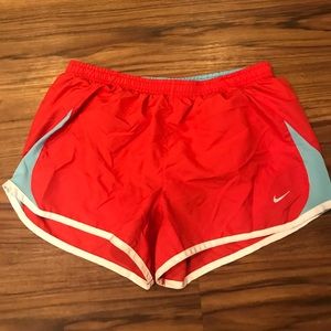 Red Nike shorts